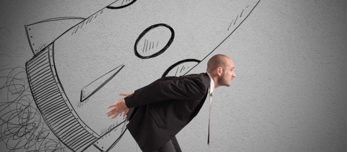 37675427 - businessman dreams to achieve success with spaceship